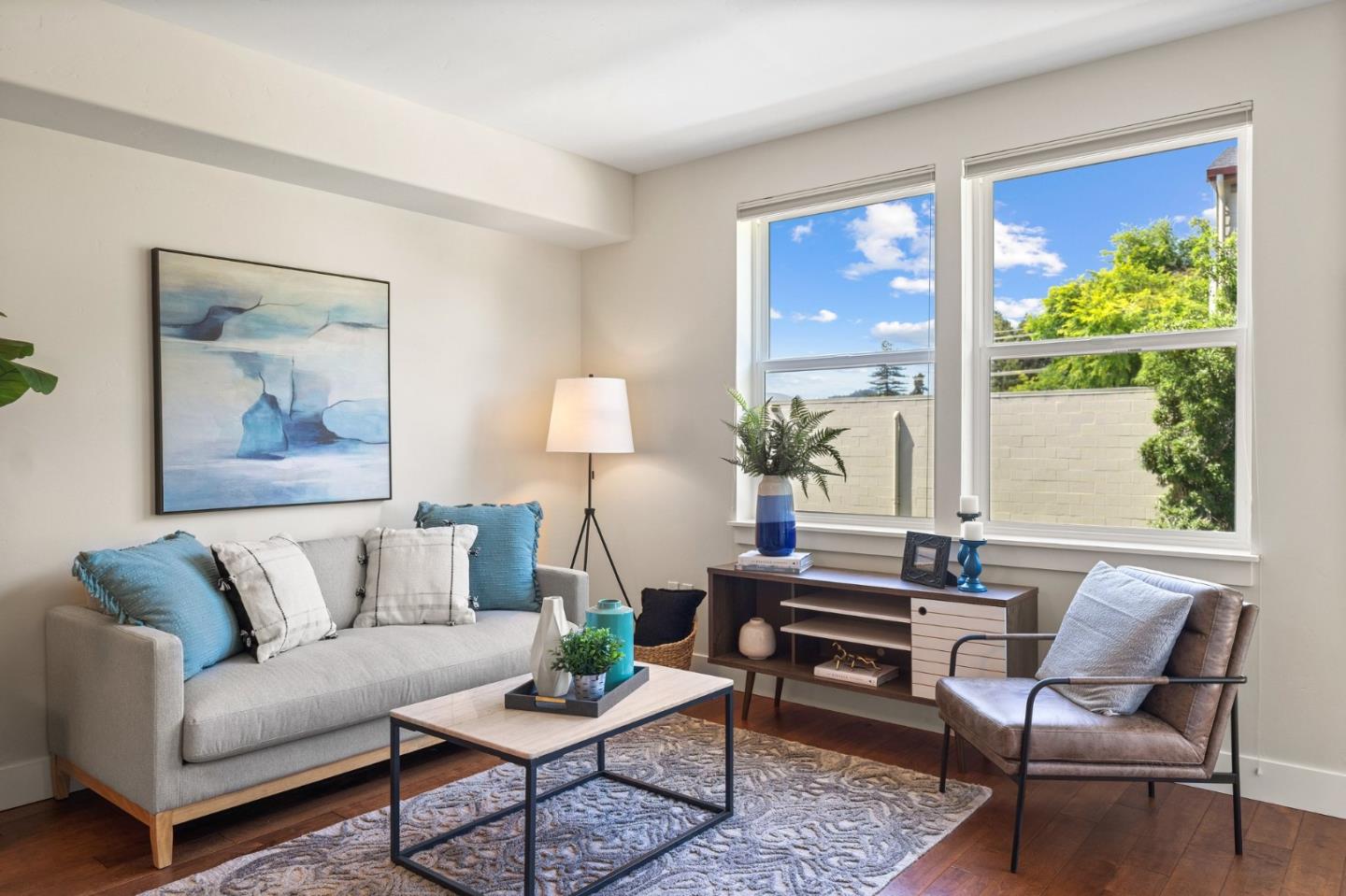 708 Frederick Street, Unit 204 Santa Cruz, CA 95062 - Photo 7 of 28 a living room with furniture and a large window