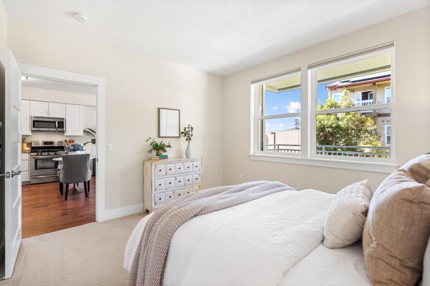 708 Frederick Street, Unit 204 Santa Cruz, CA 95062 - Photo 10 of 28 a bedroom with a large bed and a window