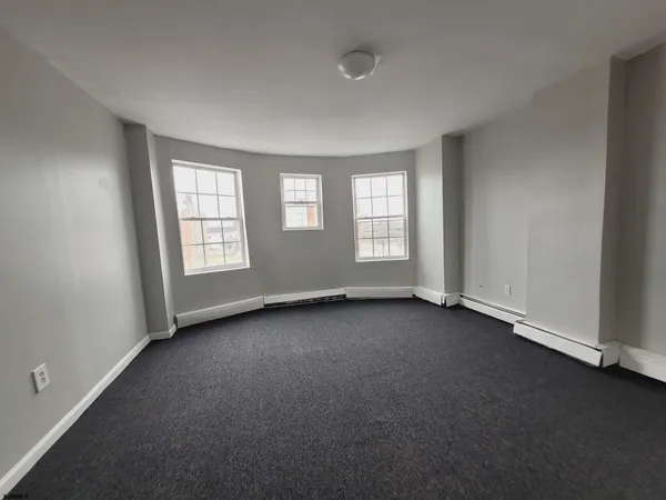 an empty room with windows