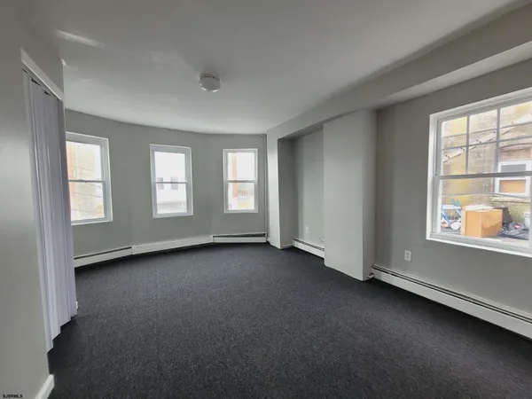 an empty room with windows