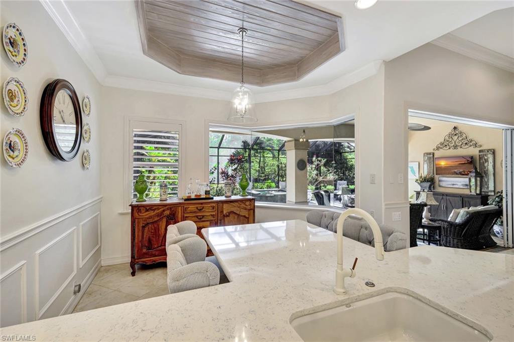 12441 Villagio Way Fort Myers, FL 33912 - Photo 14 of 32 a large white kitchen with a large window