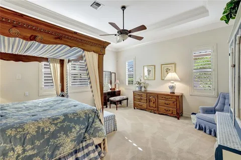 a bed room with a bed and a chair