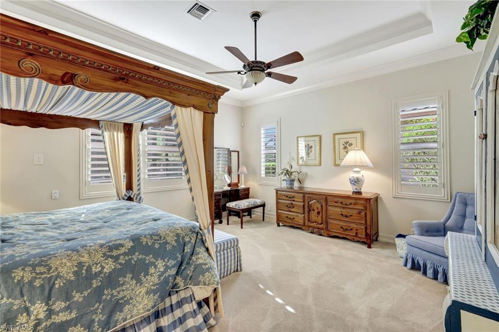 12441 Villagio Way Fort Myers, FL 33912 - Photo 17 of 32 a bed room with a bed and a chair