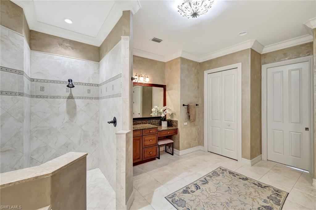 12441 Villagio Way Fort Myers, FL 33912 - Photo 19 of 32 a view of a bathroom with tub and mirror