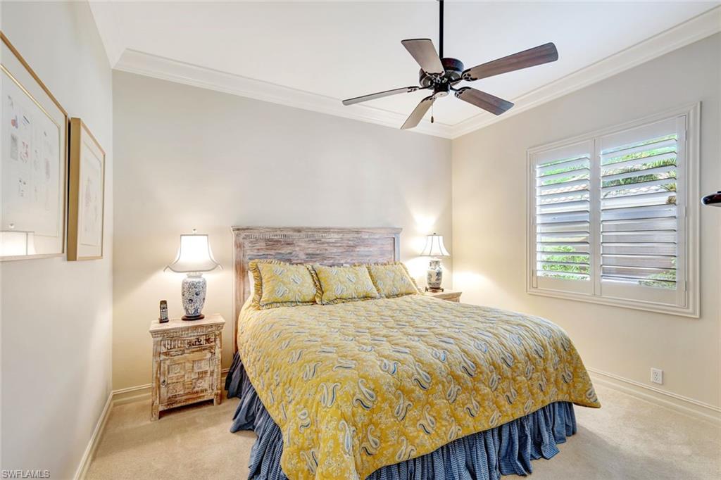 12441 Villagio Way Fort Myers, FL 33912 - Photo 20 of 32 a bedroom with a bed and window