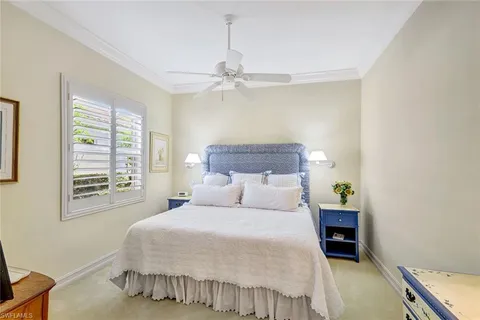 a bathroom with a granite countertop toilet sink and mirror