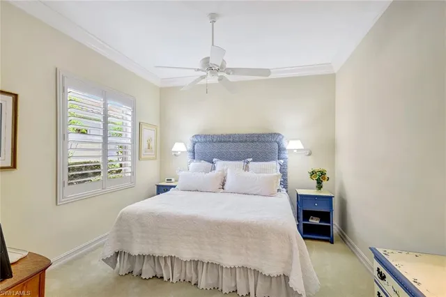 a bathroom with a granite countertop toilet sink and mirror