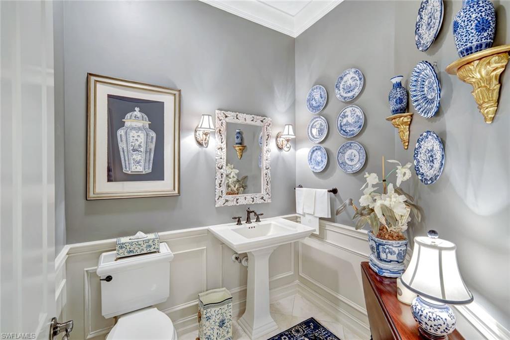 12441 Villagio Way Fort Myers, FL 33912 - Photo 24 of 32 a bathroom with a toilet a sink and a mirror