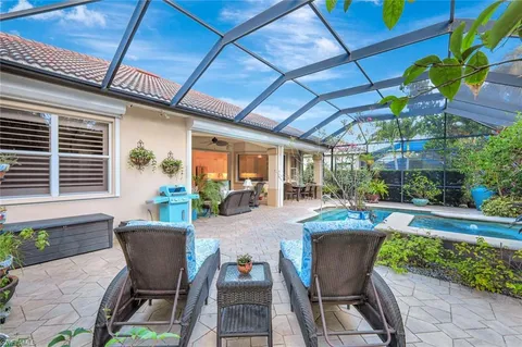 a view of a backyard with plants and a patio