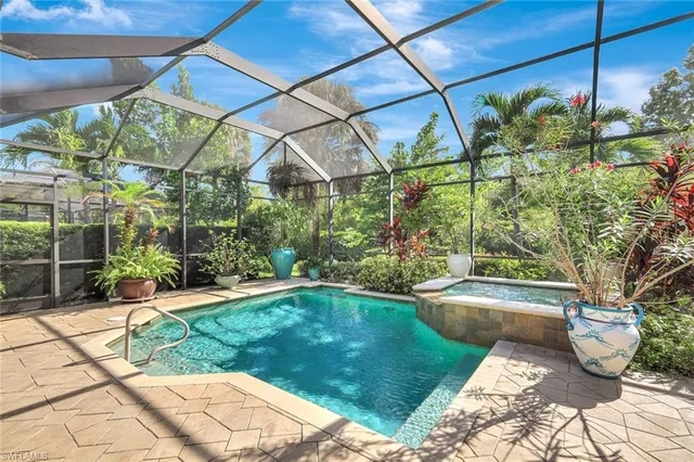 a view of a backyard with swimming pool