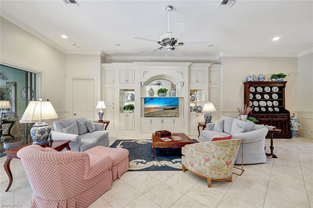12441 Villagio Way Fort Myers, FL 33912 - Photo 6 of 32 a living room with furniture and a chandelier