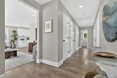 a view of a living room and entryway