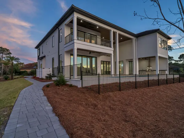 a view of swimming pool with lake and mountain view in back