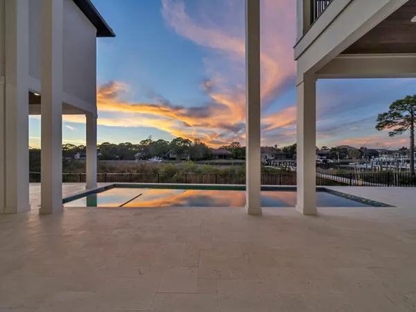 a view of swimming pool from a balcony