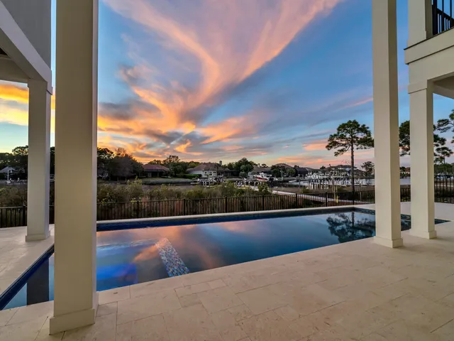a kitchen with sink a refrigerator and washer