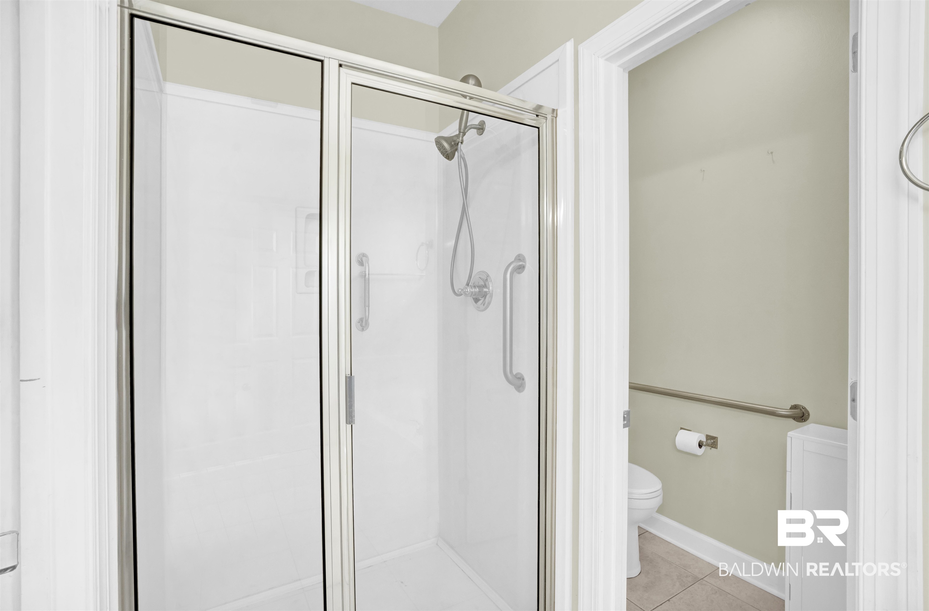 100 Conti Court Fairhope, AL 36532 - Photo 37 of 54 Bathroom featuring tile patterned flooring, a shower with shower door, and toilet