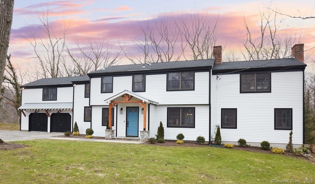 460 Papurah Road Fairfield, CT 06825 - Photo 1 of 1 a front view of a house with a yard