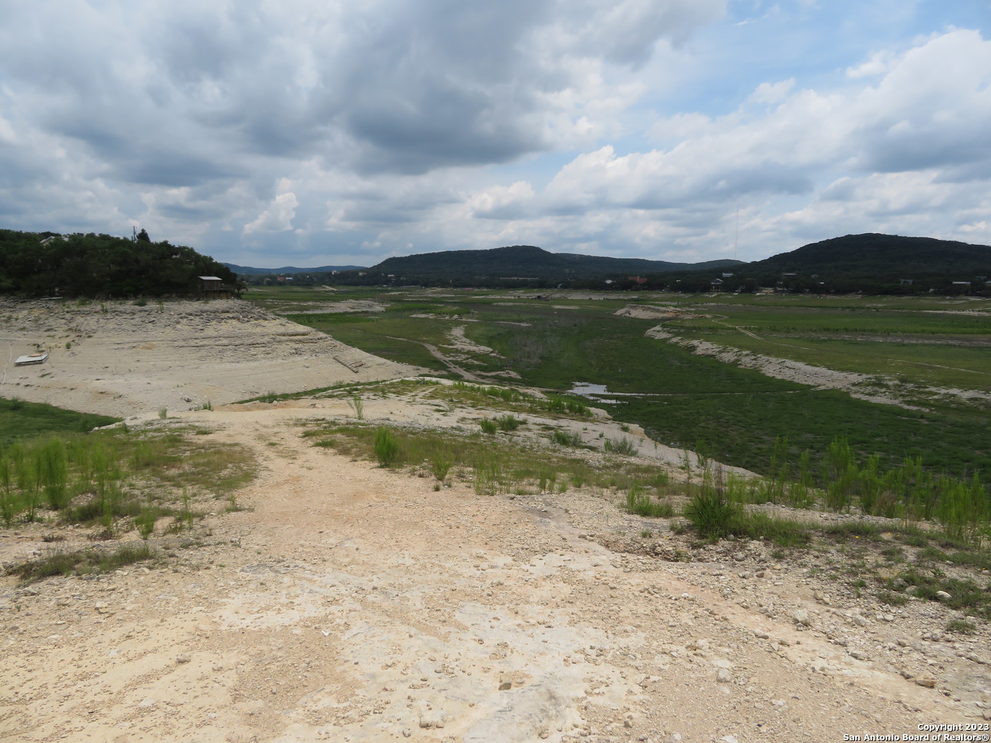 0 Hilltop Loop Lakehills, TX 78063 - Photo 11 of 32 a view of a lake with a beach