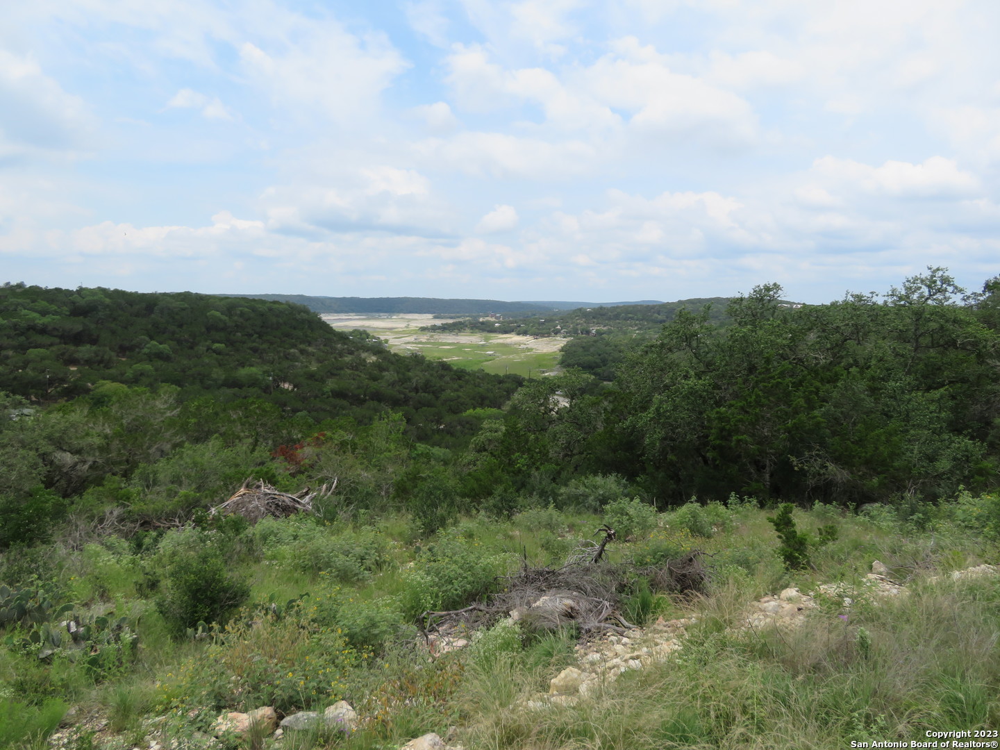 0 Hilltop Loop Lakehills, TX 78063 - Photo 16 of 32 a view of a lush green forest with lots of trees