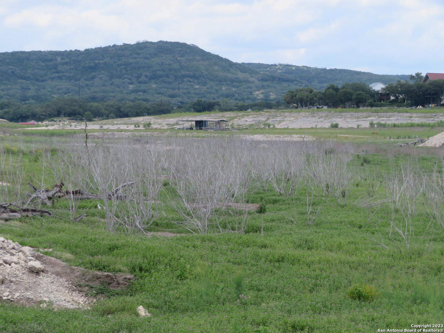 0 Hilltop Loop Lakehills, TX 78063 - Photo 25 of 32 a view of lake with mountain in the background