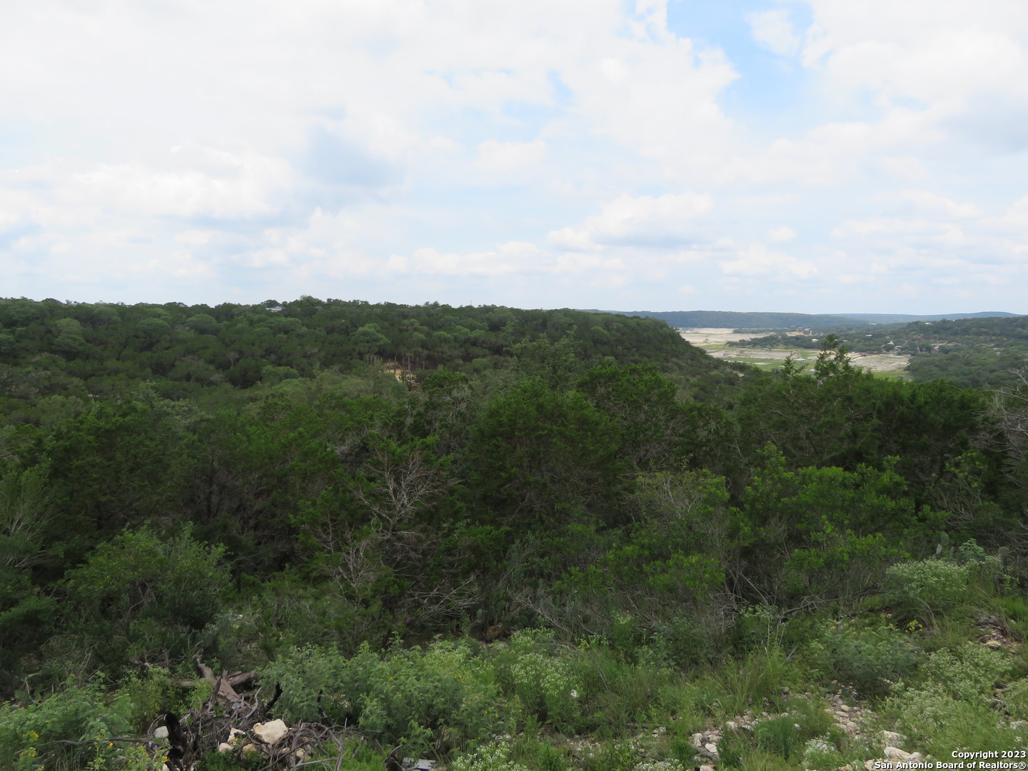 0 Hilltop Loop Lakehills, TX 78063 - Photo 28 of 32 an aerial view of residential houses with outdoor space and trees