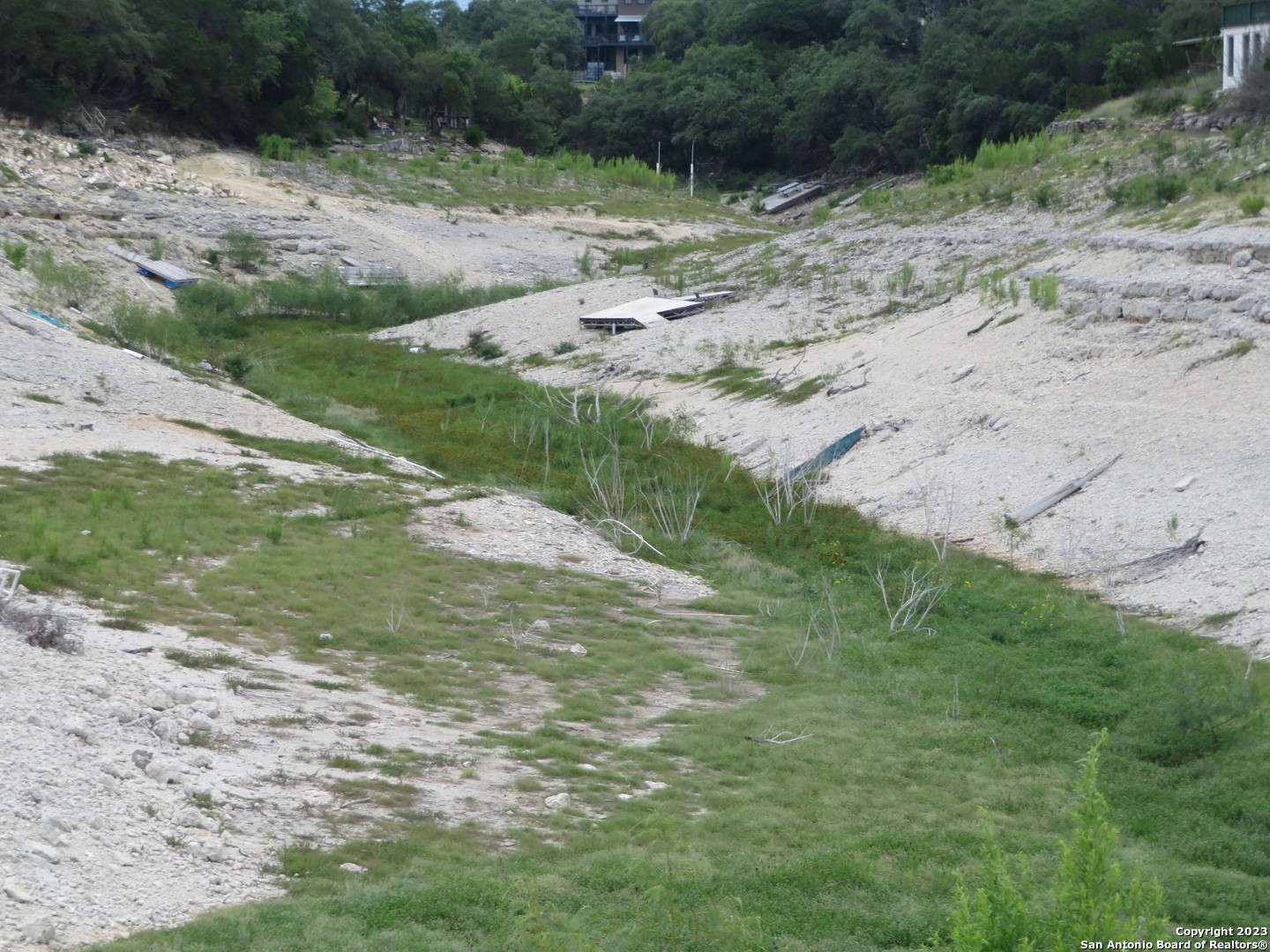 0 Hilltop Loop Lakehills, TX 78063 - Photo 31 of 32 a view of a road with a yard