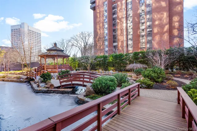 a front view of a house with yard and outdoor seating