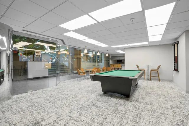 a room with furniture and view of living room