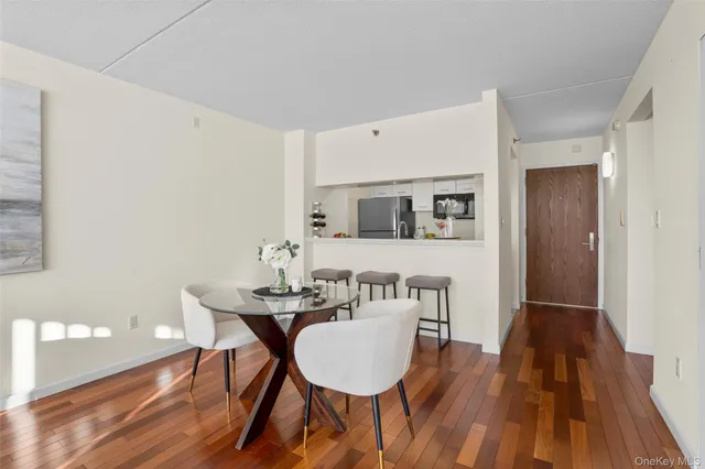 a dining room with furniture and wooden floor