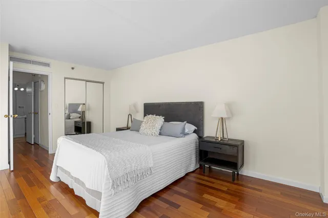 a bedroom with a bed and a table