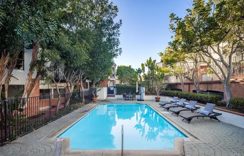 a view of a swimming pool with a patio