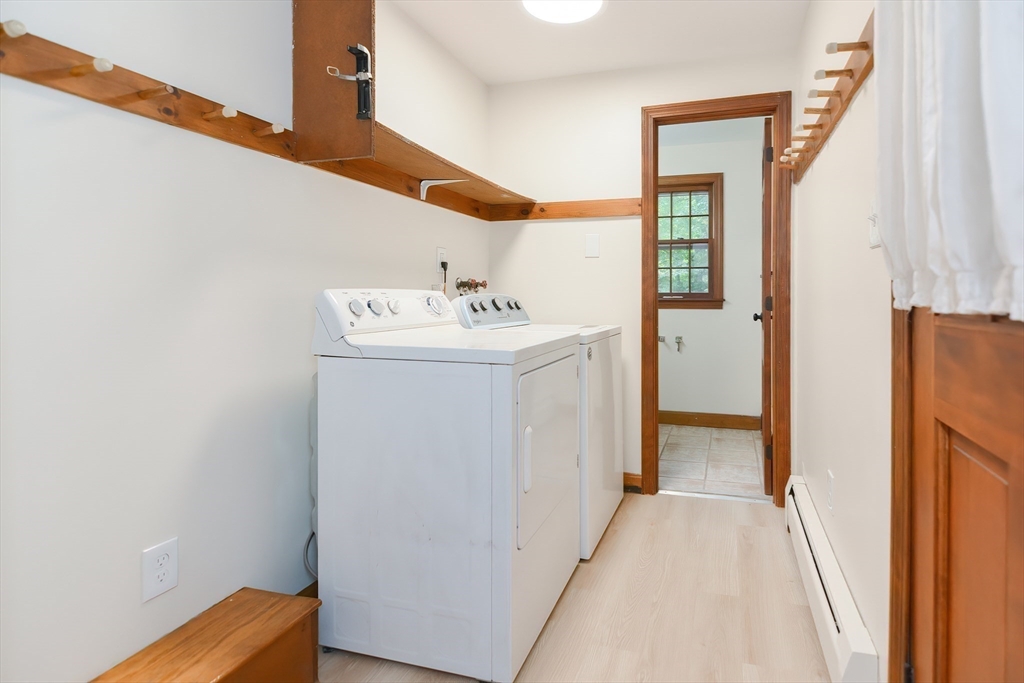 156 Wheeler Road Hollis, NH 03049 - Photo 11 of 42 a utility room with dryer and washer