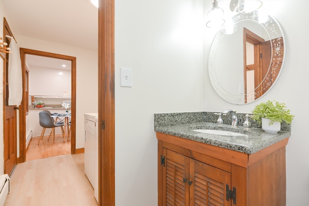 156 Wheeler Road Hollis, NH 03049 - Photo 12 of 42 a bathroom with a granite countertop sink and a mirror