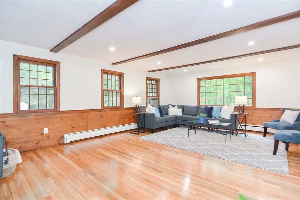 156 Wheeler Road Hollis, NH 03049 - Photo 19 of 42 a living room with furniture and a large window