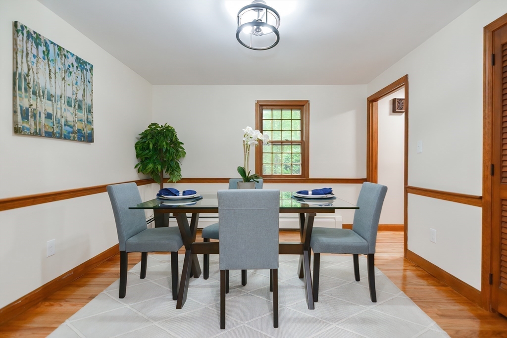 156 Wheeler Road Hollis, NH 03049 - Photo 25 of 42 a view of a dining room with furniture and a window