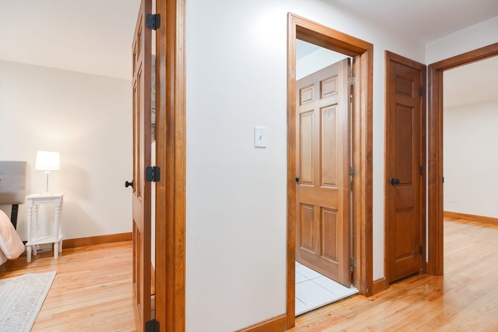 156 Wheeler Road Hollis, NH 03049 - Photo 29 of 42 a view of a hallway with wooden floor