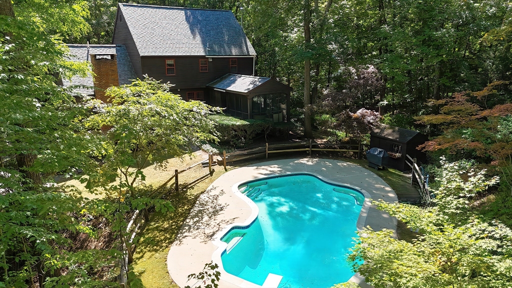 156 Wheeler Road Hollis, NH 03049 - Photo 3 of 42 a view of a swimming pool with a yard