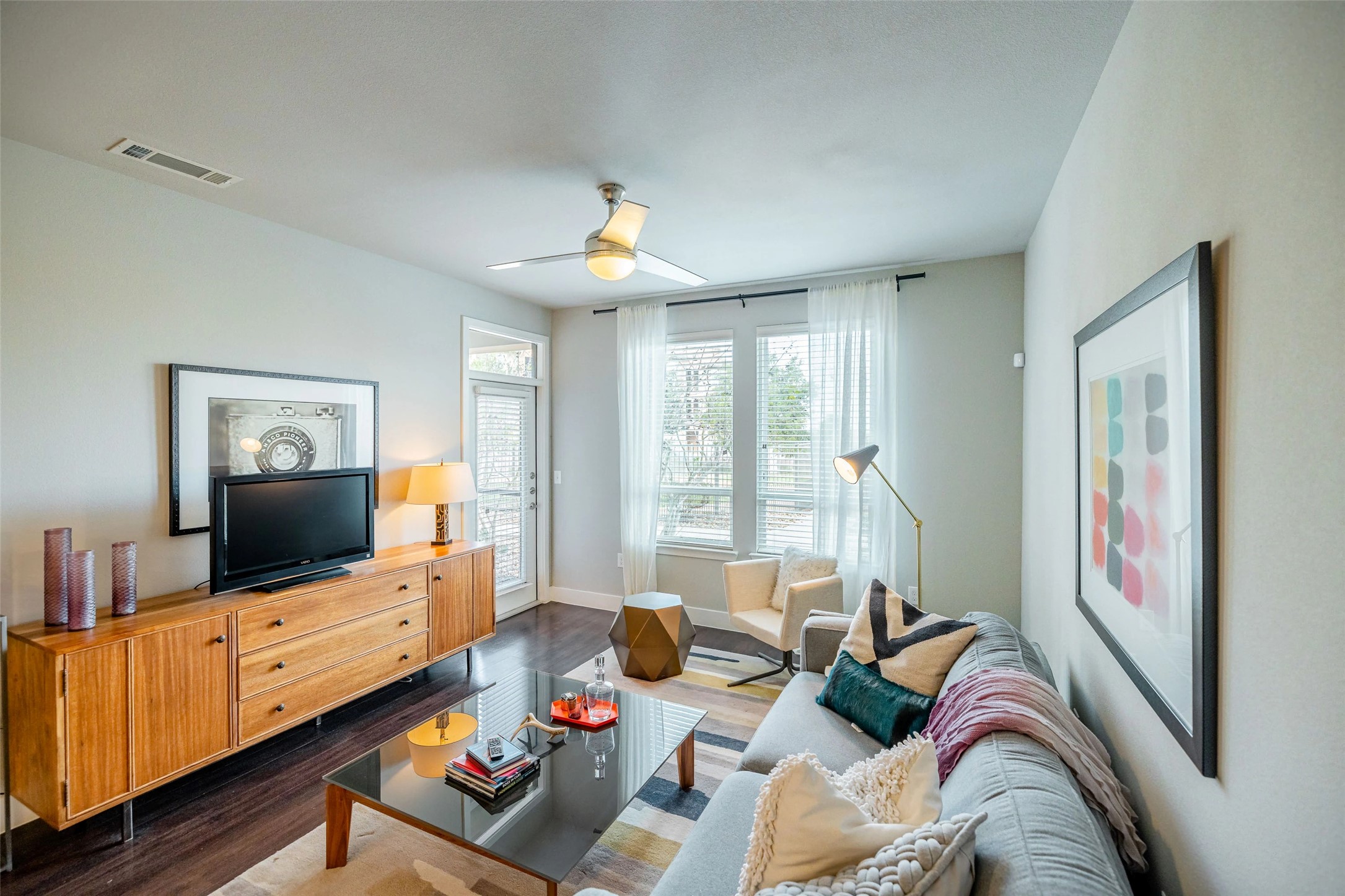 4800 Steiner Ranch Boulevard, Unit 12207 Austin, TX 78732 - Photo 11 of 19 a living room with furniture and a flat screen tv