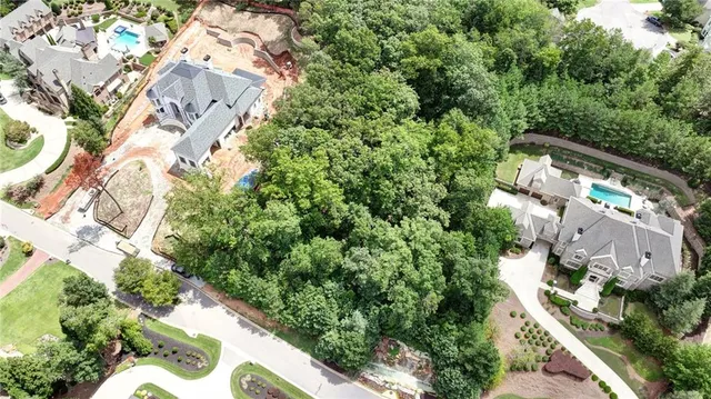 an aerial view of multiple houses with yard