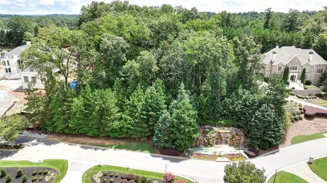 a view of a garden with an outdoor seating