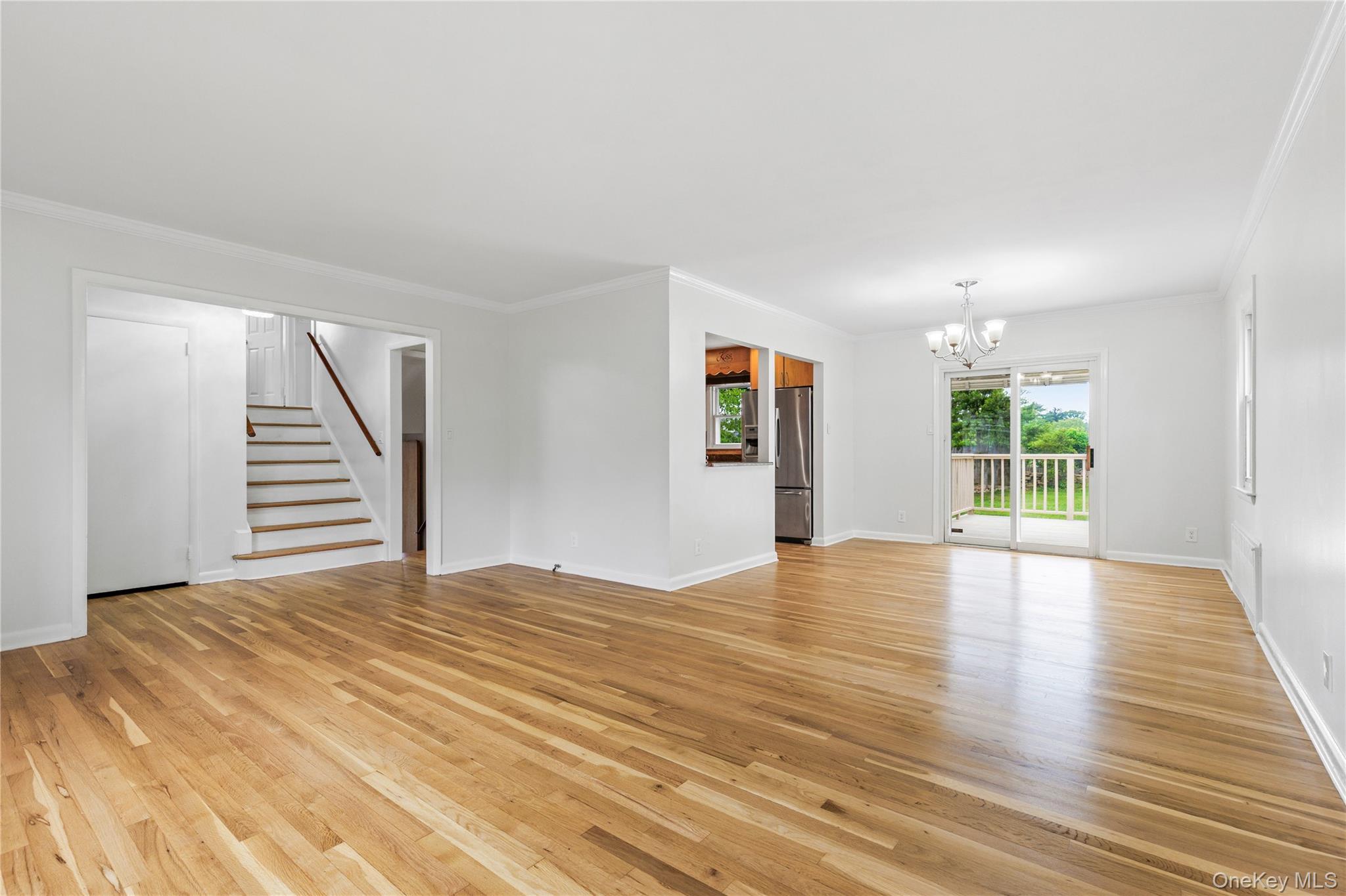 46 Mathews Street Harrison, NY 10528 - Photo 5 of 30 a view of an empty room with wooden floor and a window