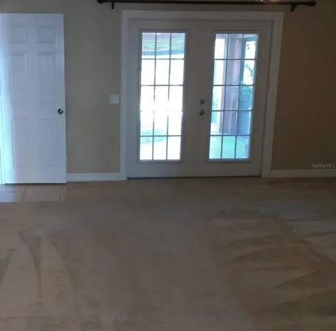 an empty room that has a window