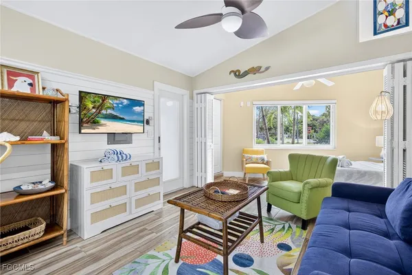a living room with furniture and a window