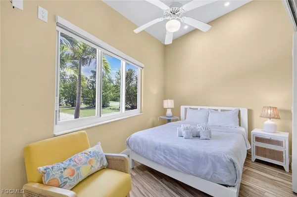 a bedroom with a bed couch and window