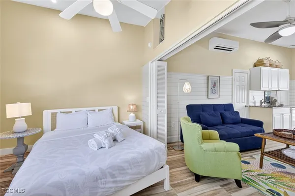 a bedroom with a bed and a couch