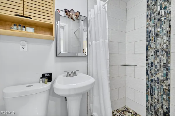 a bathroom with a sink and a toilet