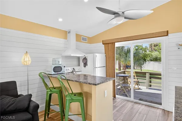 a dining room with furniture and wooden floor