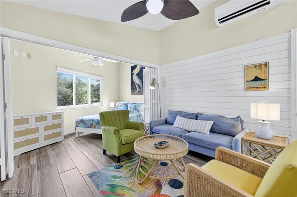 a living room with furniture and a window