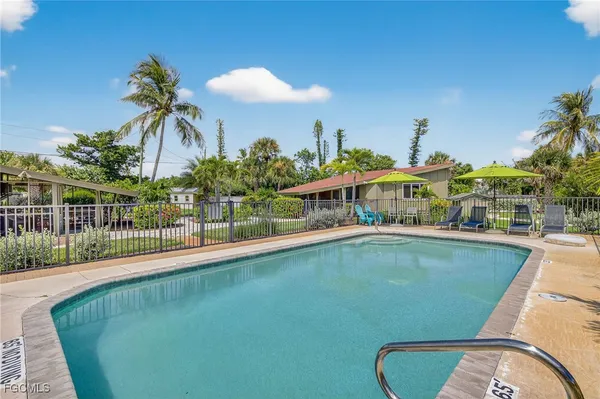a view of swimming pool from a balcony