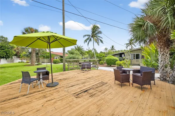 a view of a backyard with sitting area